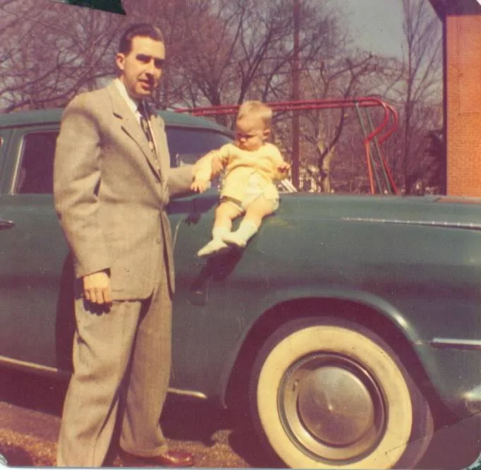 baby-me-on-car-with-dad-1952.webp