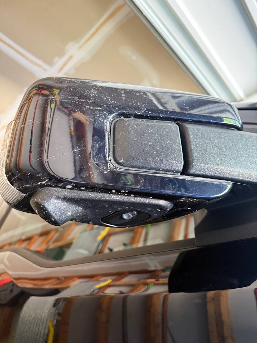 Ford F-150 Lightning Mirror trim loose near camera/puddle lamp IMG_5340