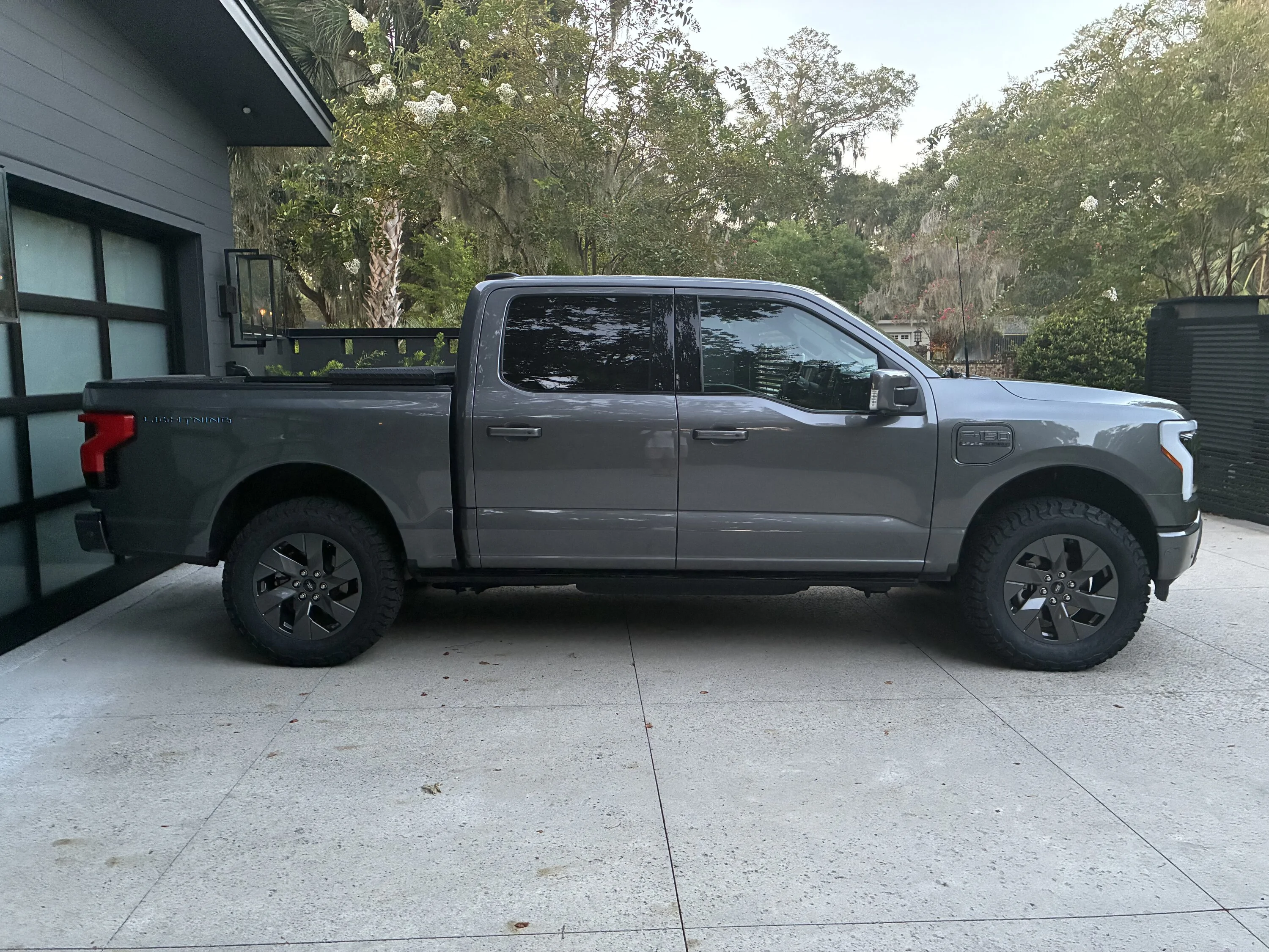 Ford F-150 Lightning Pics and range info: Eibach 2.6” leveling shock and KO3 295/60/20 tires on Lariat ER IMG_4652