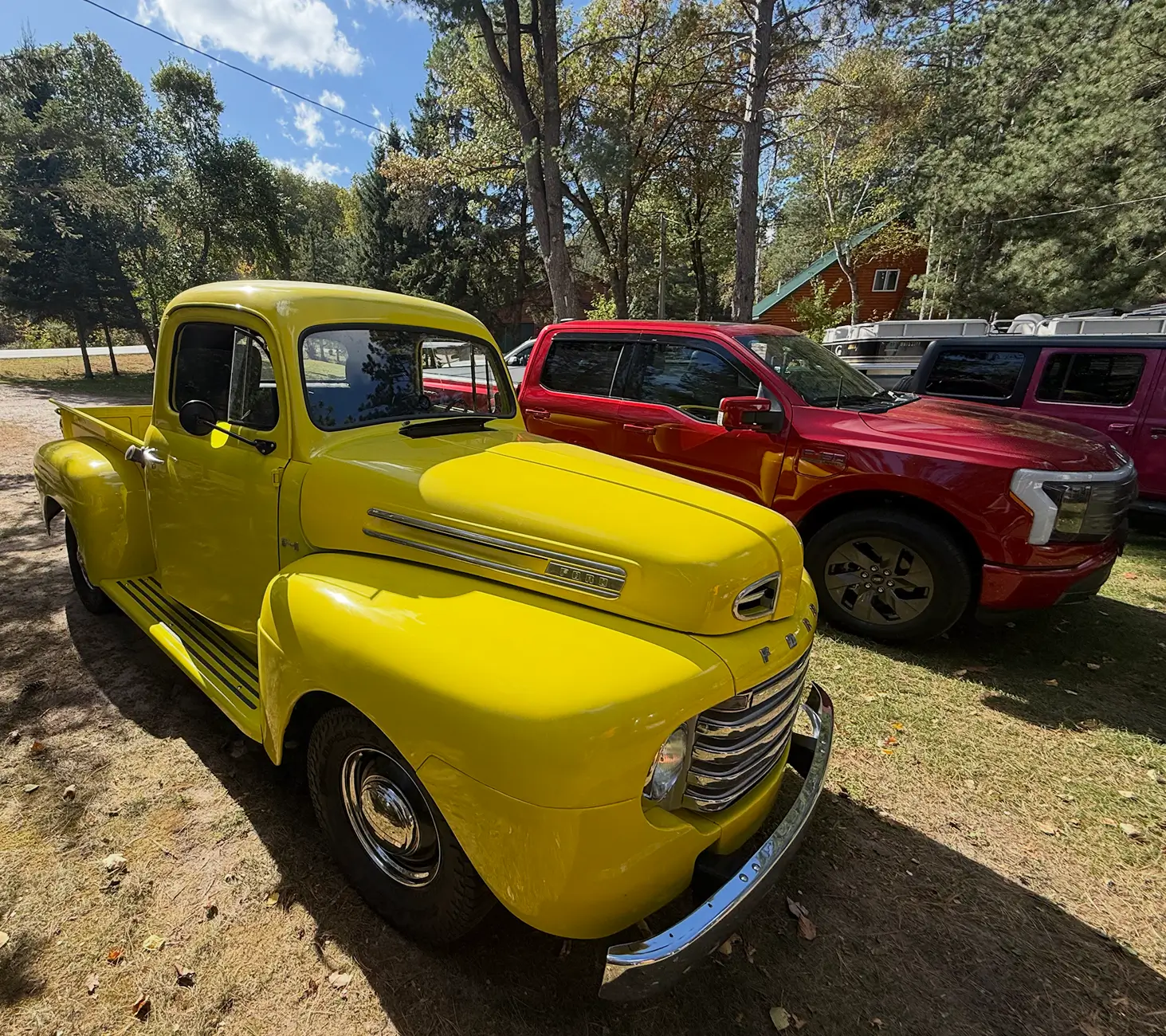 Ford F-150 Lightning 1950 F-1 and 2023 F-150 Lightning hanging out Screenshot 2025-10-10 at 1.12.12 PM