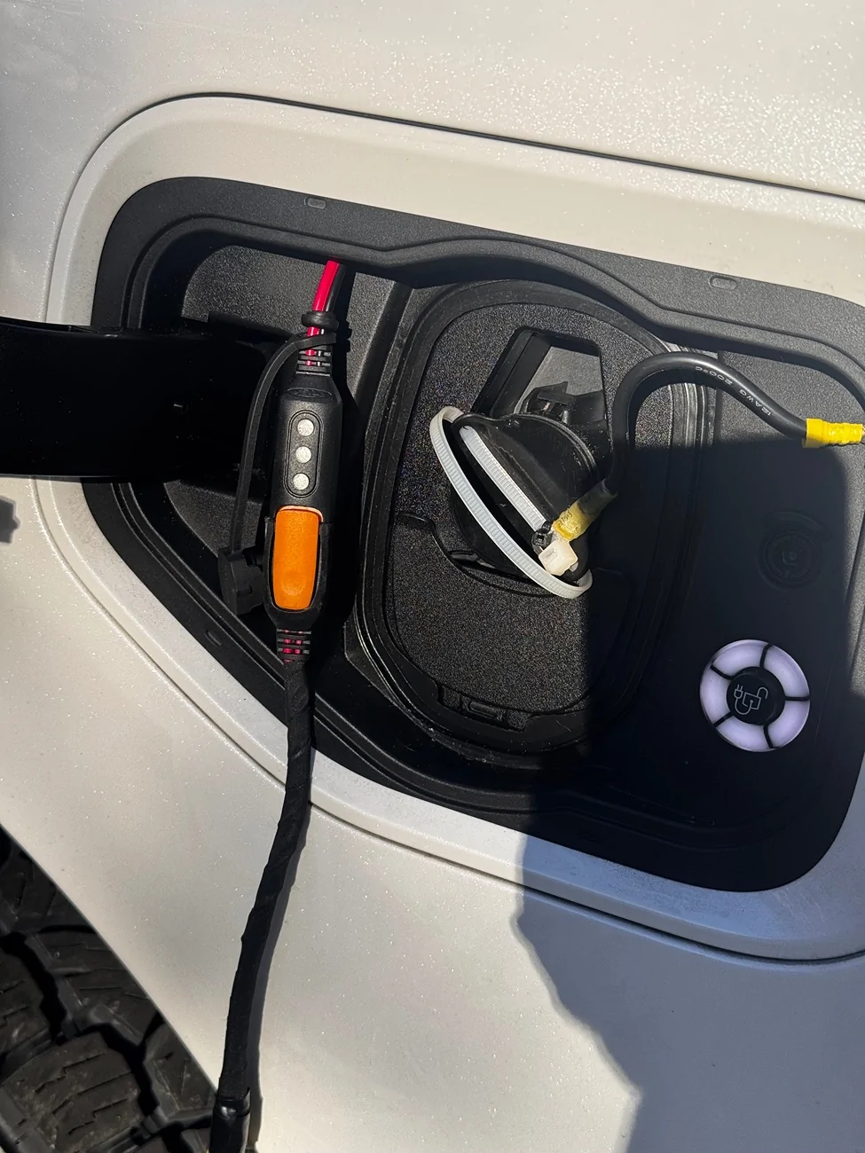 Ford F-150 Lightning Battery tender leads thru charge port cover IMG_9748