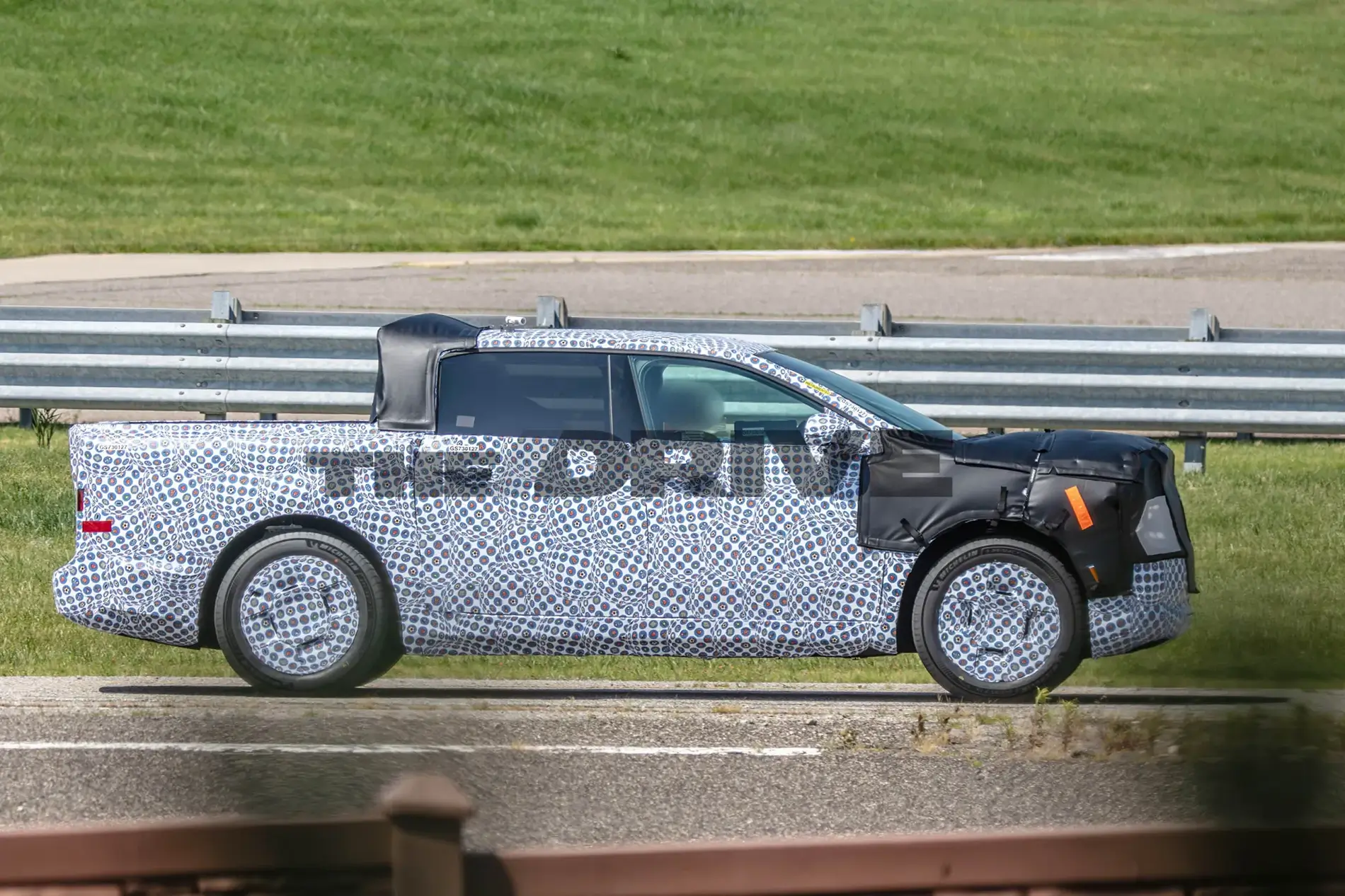 Ford F-150 Lightning It's TINY! Ford's new $30k EV truck spotted (in camo) next to an Expedition for scale 1783436126758-nl