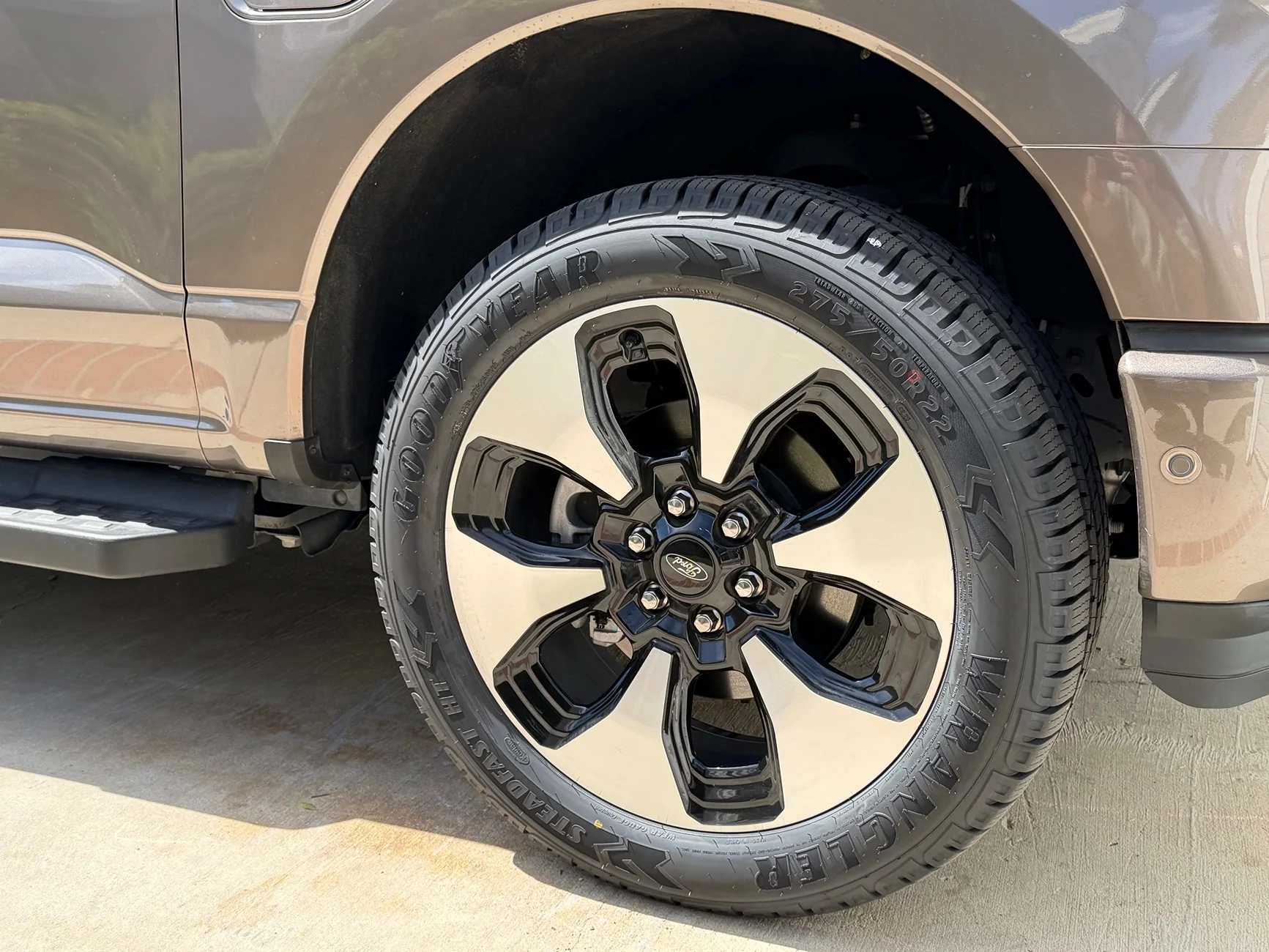 Ford F-150 Lightning What tire would give a little more size and aggressiveness to the 22" Platinum wheels without a lift? IMG_4356