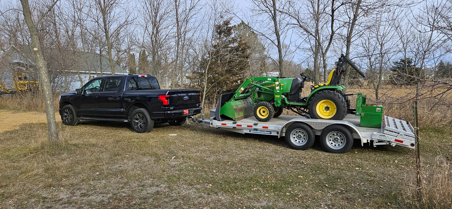Ford F-150 Lightning Towing compact tractor-loader w/ 5' mower on dbl axle 20231122_145042