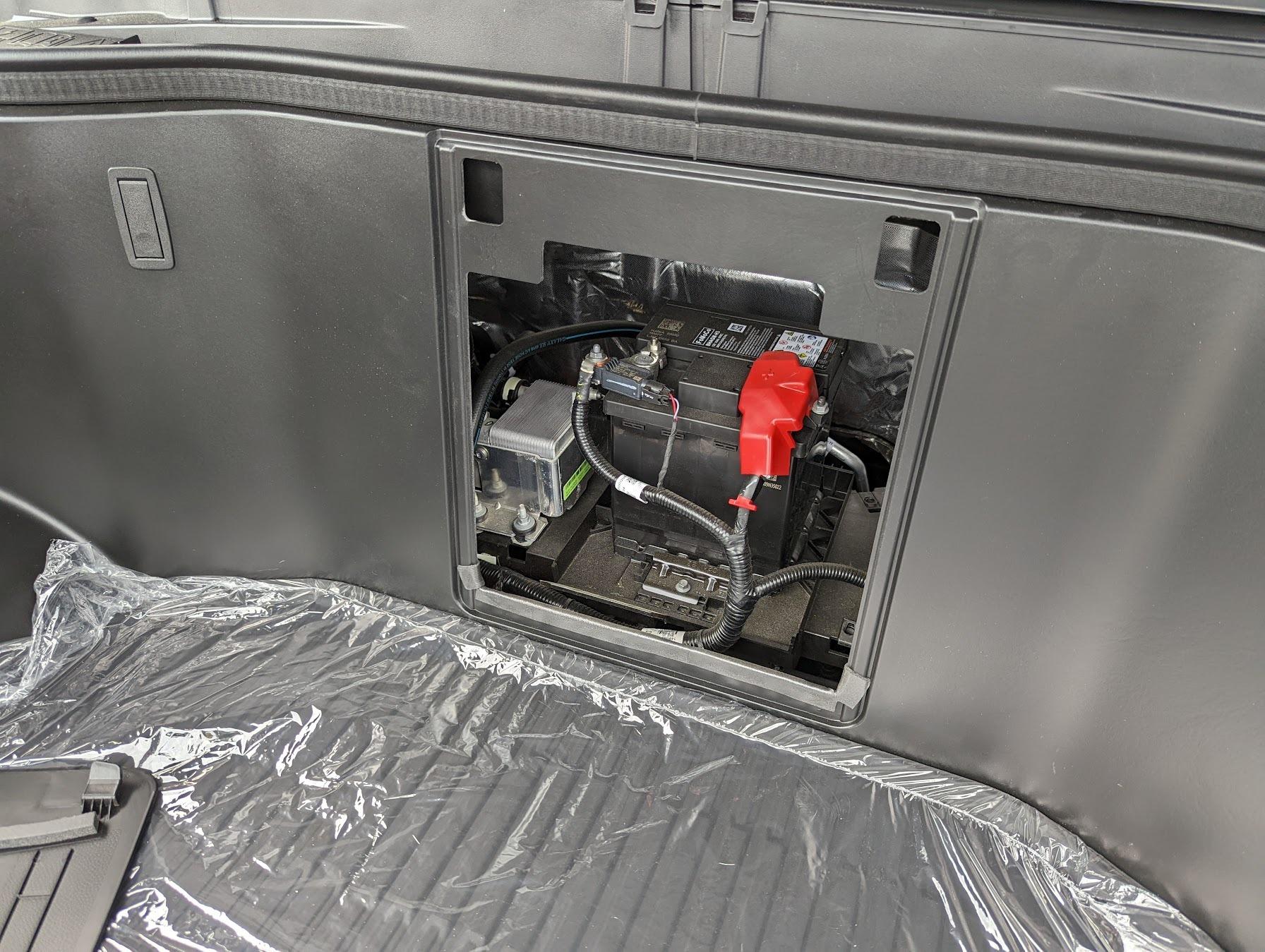 Ford F-150 Lightning 12v Battery access location in Lightning frunk for easy replacement 2022 f150 lightning 12v battery location in frunk front trunk
