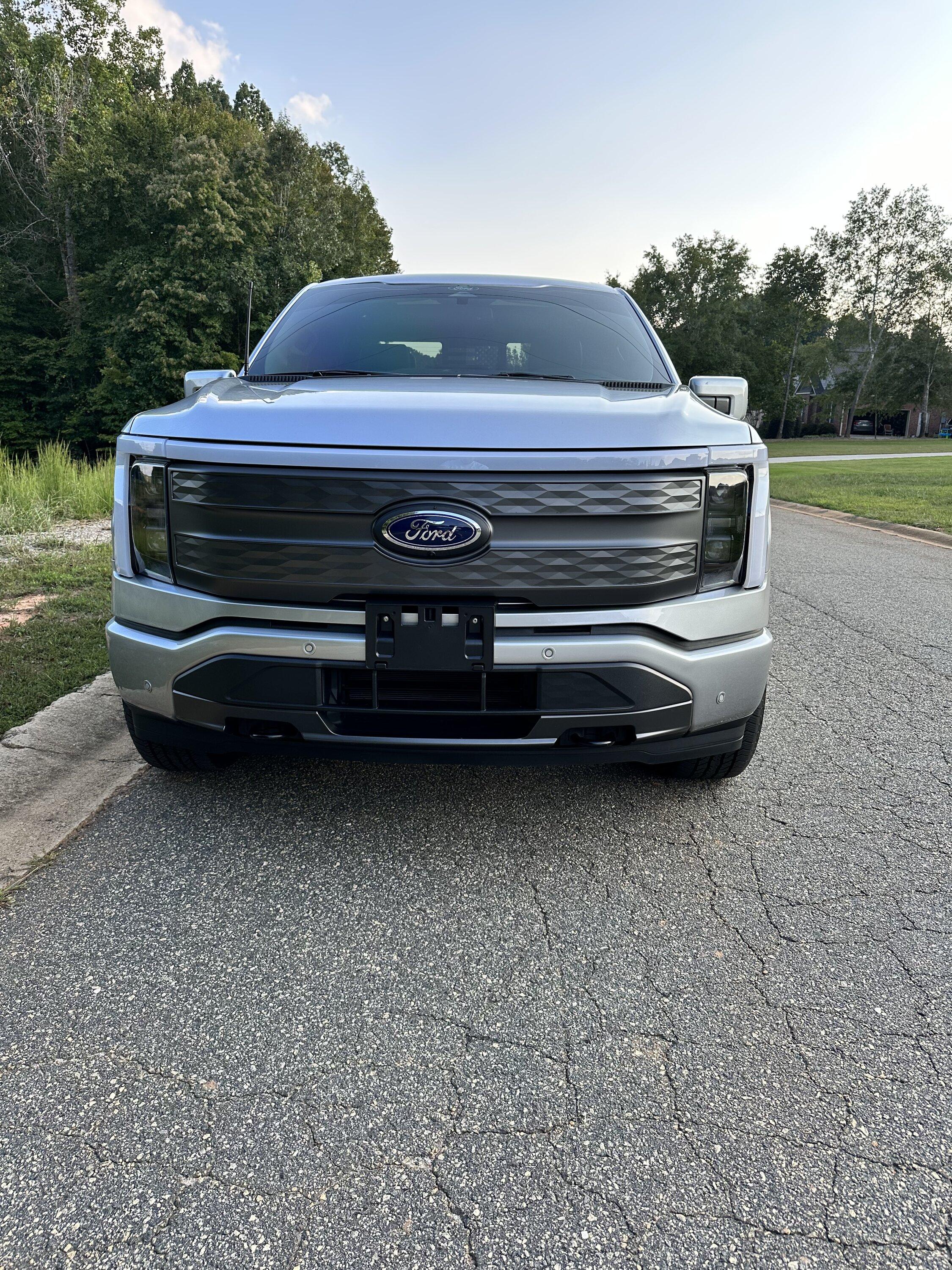Ford F-150 Lightning Gloss black 20" wheels on my Lightning Lariat with stock AT tires, tints, AMP Power Steps 7674F04F-3BCF-4D25-AFAF-27103E3F379C