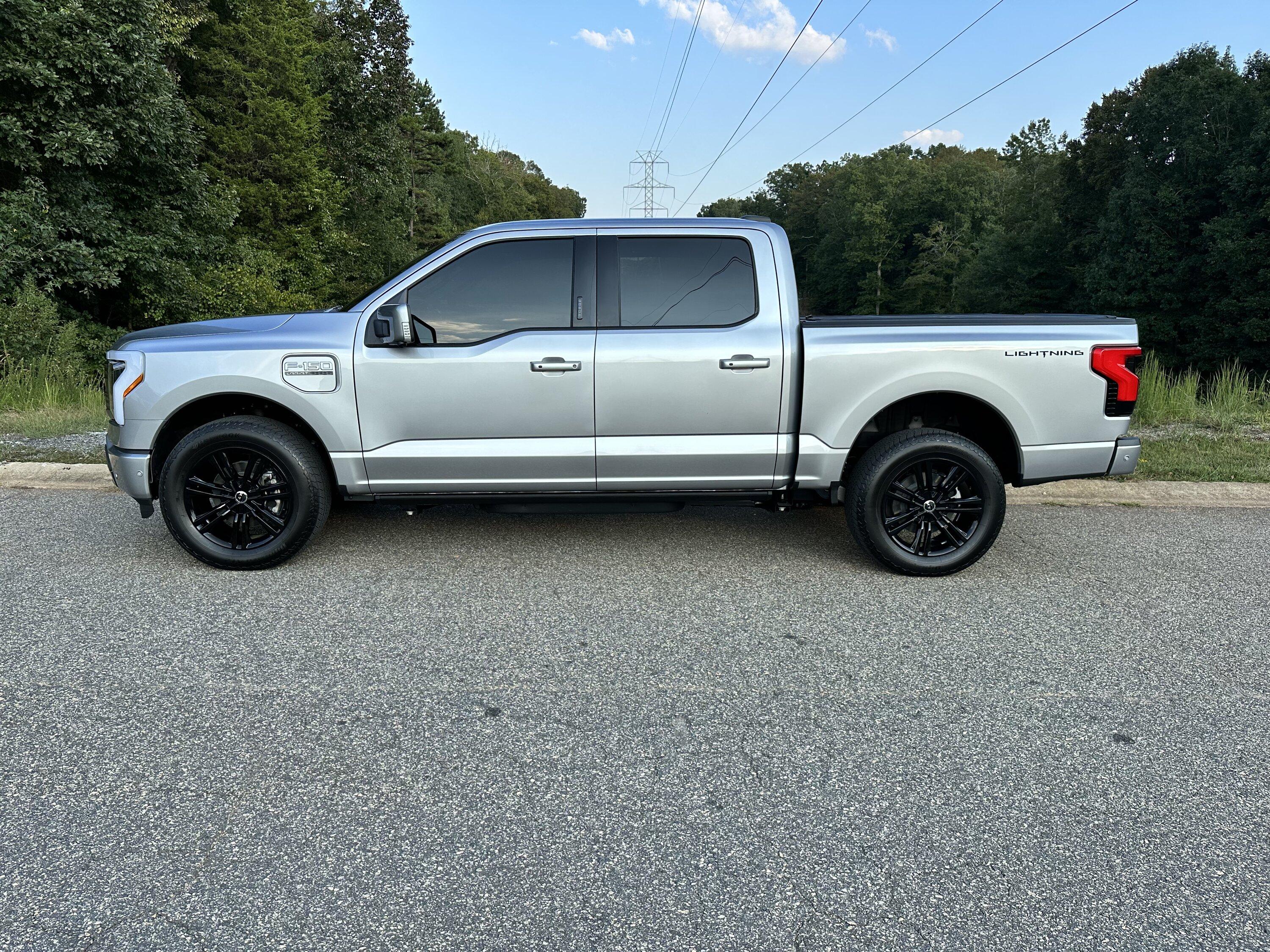 Ford F-150 Lightning Gloss black 20" wheels on my Lightning Lariat with stock AT tires, tints, AMP Power Steps 64CAE50F-1B09-4609-98CA-D9A3A283CF6B
