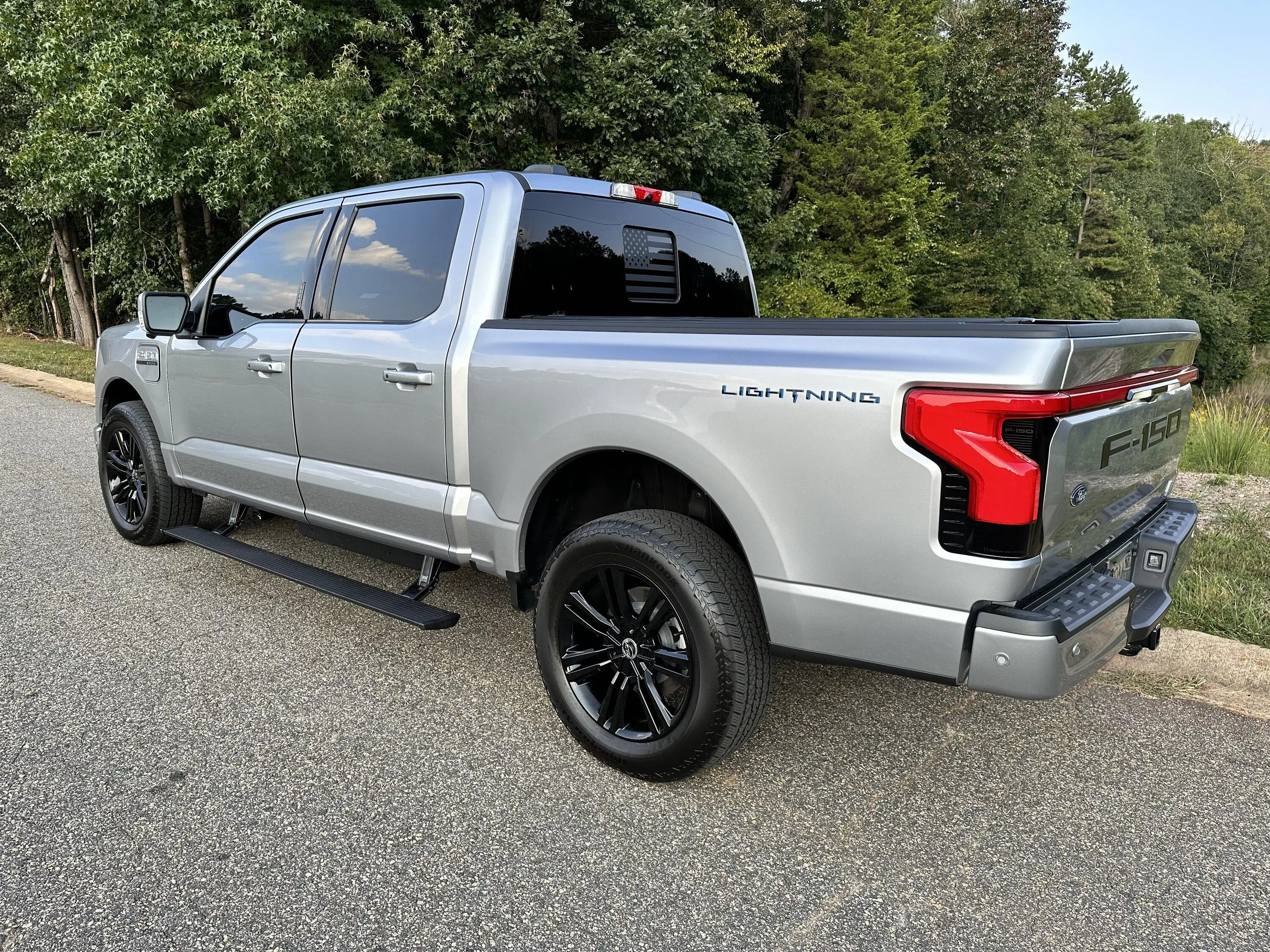 Ford F-150 Lightning Gloss black 20" wheels on my Lightning Lariat with stock AT tires, tints, AMP Power Steps 6F482B6C-075B-43E6-8B77-5F178764BC1C
