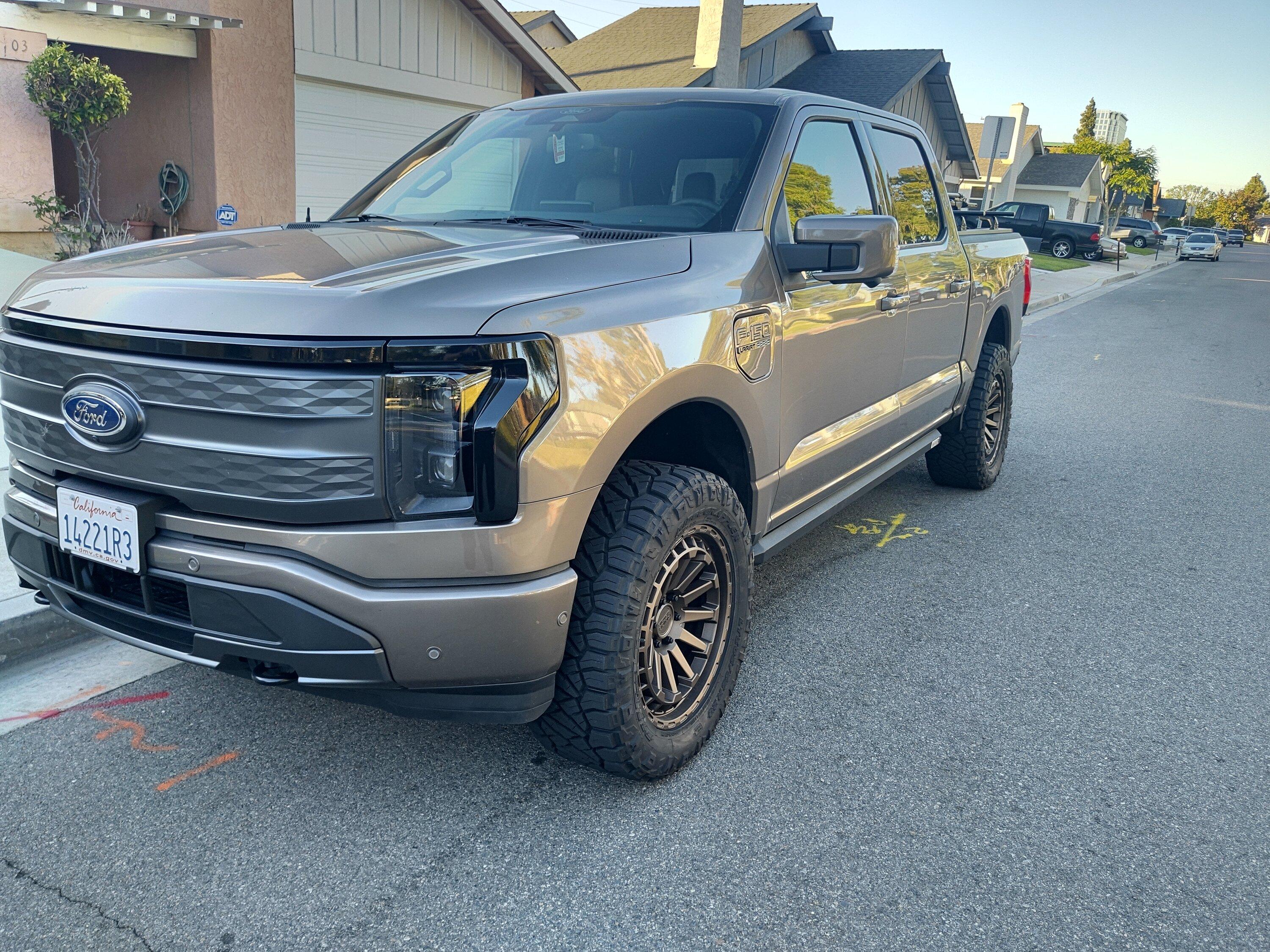 Ford F-150 Lightning Stone Gray Lightning leveled on 20" Black Rhino wheels, blacked out LED light bar, cross bars, bike rack IMG_20221114_155112