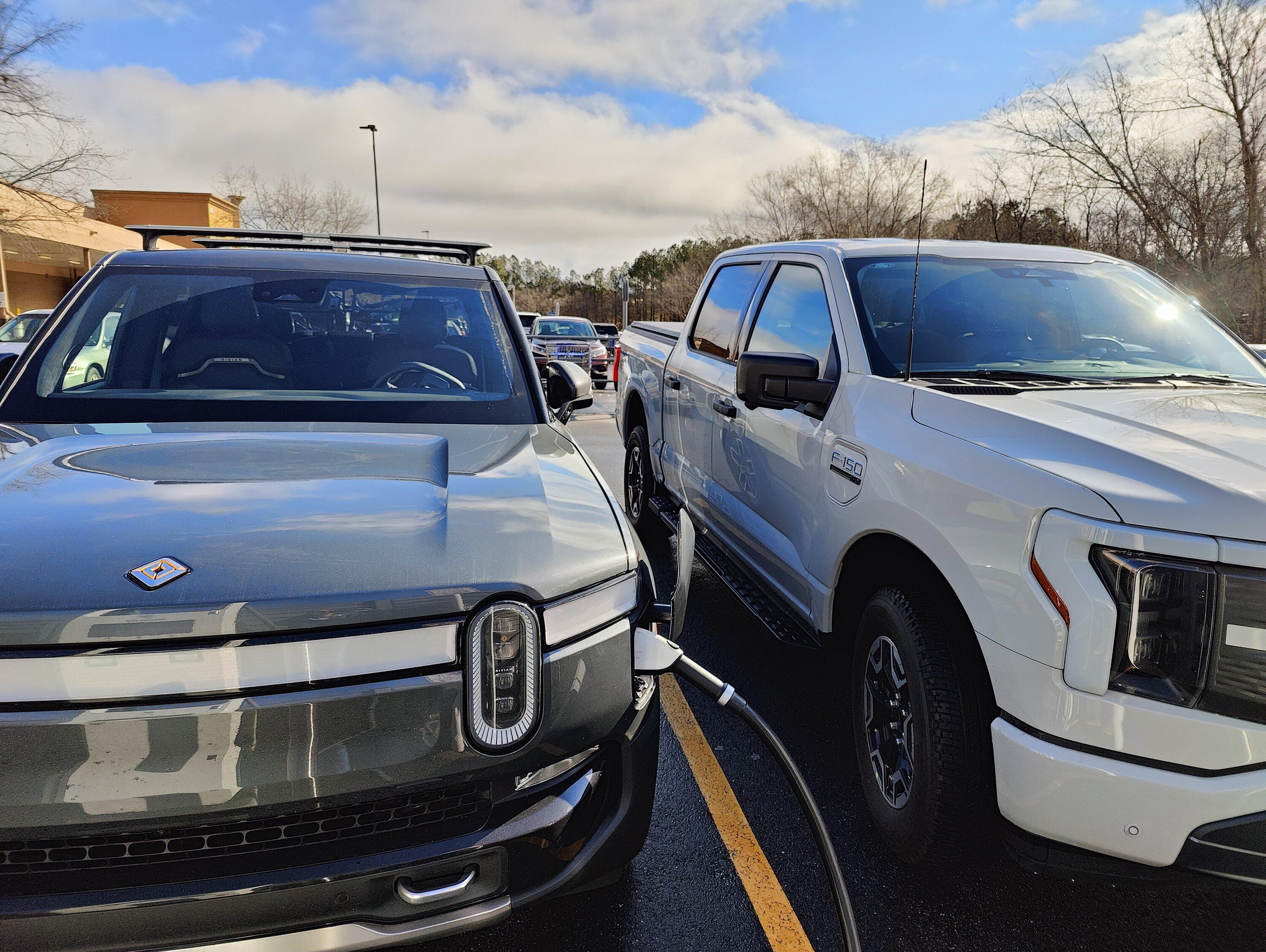 Ford F-150 Lightning Lightning pictured next to Rivian IMG20230217100650