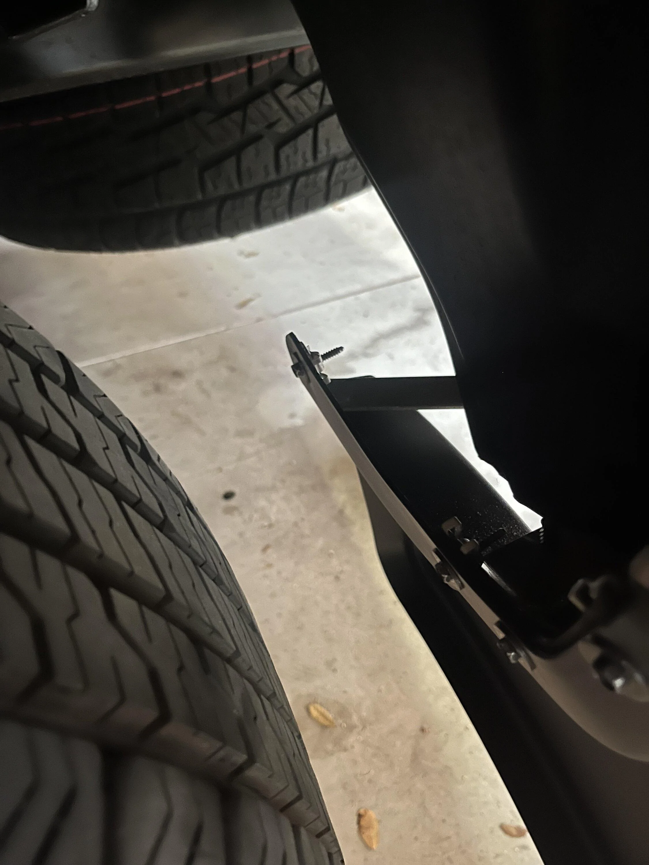 Ford F-150 Lightning OEM Mudflap Design update (maybe?). No more drilling required IMG_3043