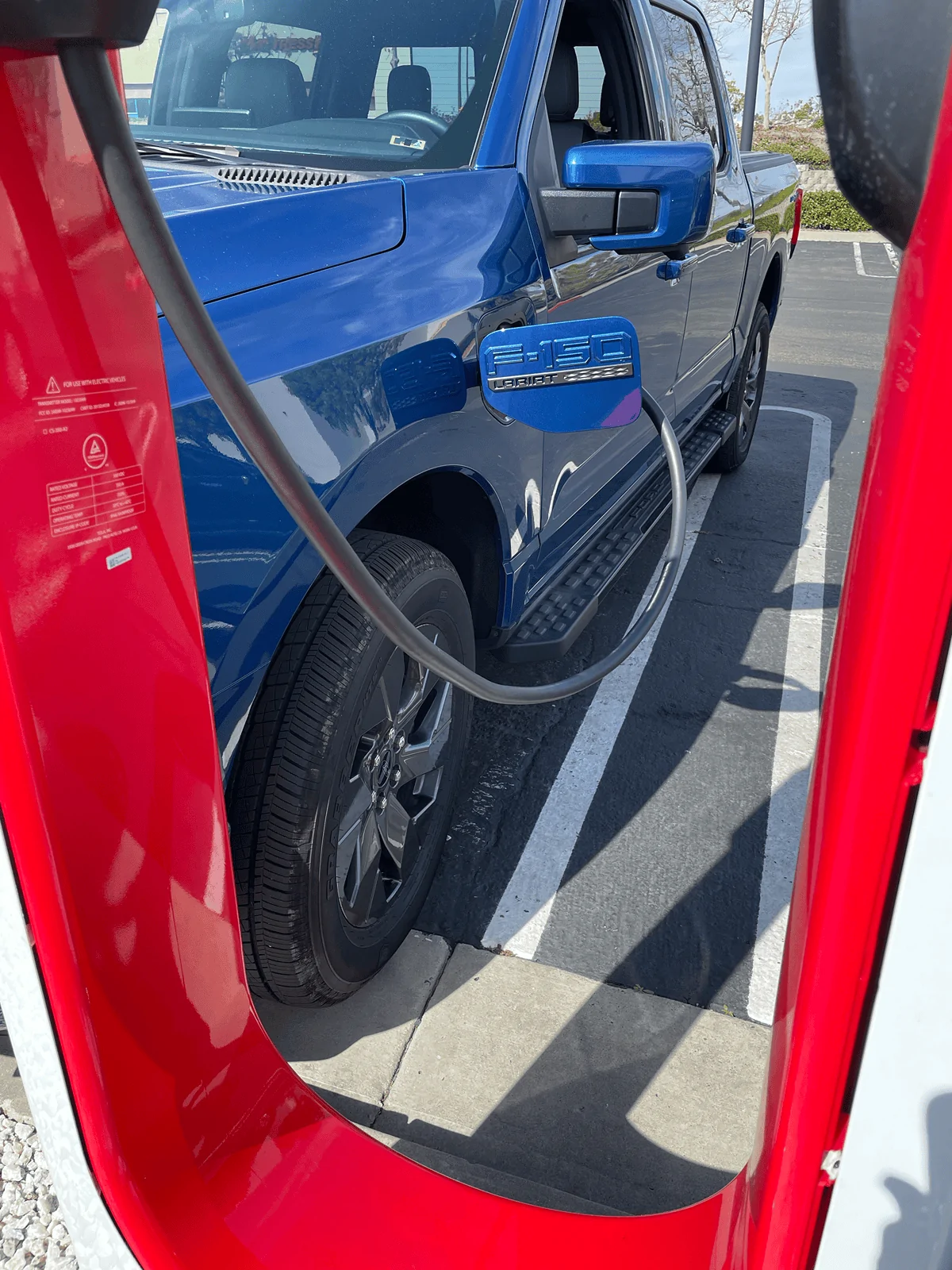 Ford F-150 Lightning Photos from new Tesla Supercharging station w/ new charger placement (for trucks) tempImageBa6J7