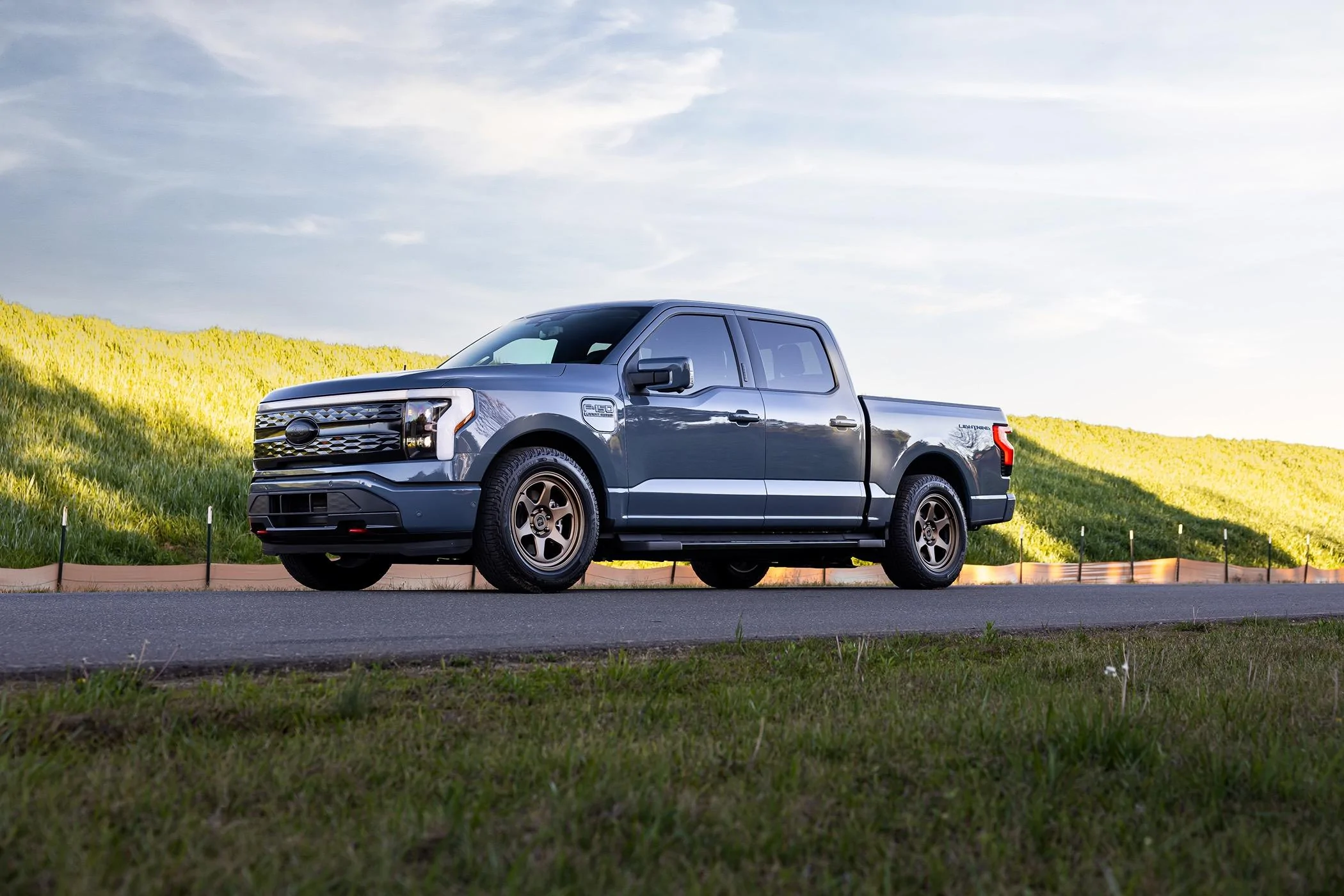 Ford F-150 Lightning Beauty shots of my Lightning. New, fully forged Trex T-200 bronze wheels, ICON stage IV lowering kit, gloss black vinyl wrapped grill, other goodies. 20240406-9j0a5126-edit