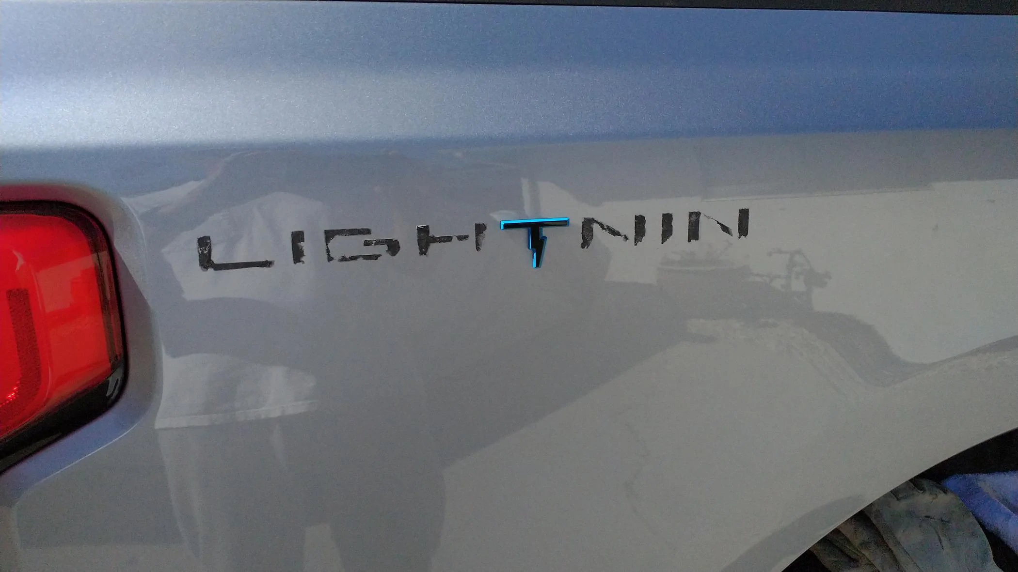 Ford F-150 Lightning Got My First Thumbs Down [ADMIN WARNING: NO POLITICS] IMG_20231006_114035182 peeling lightning letters off pickup bed sides leaving the T