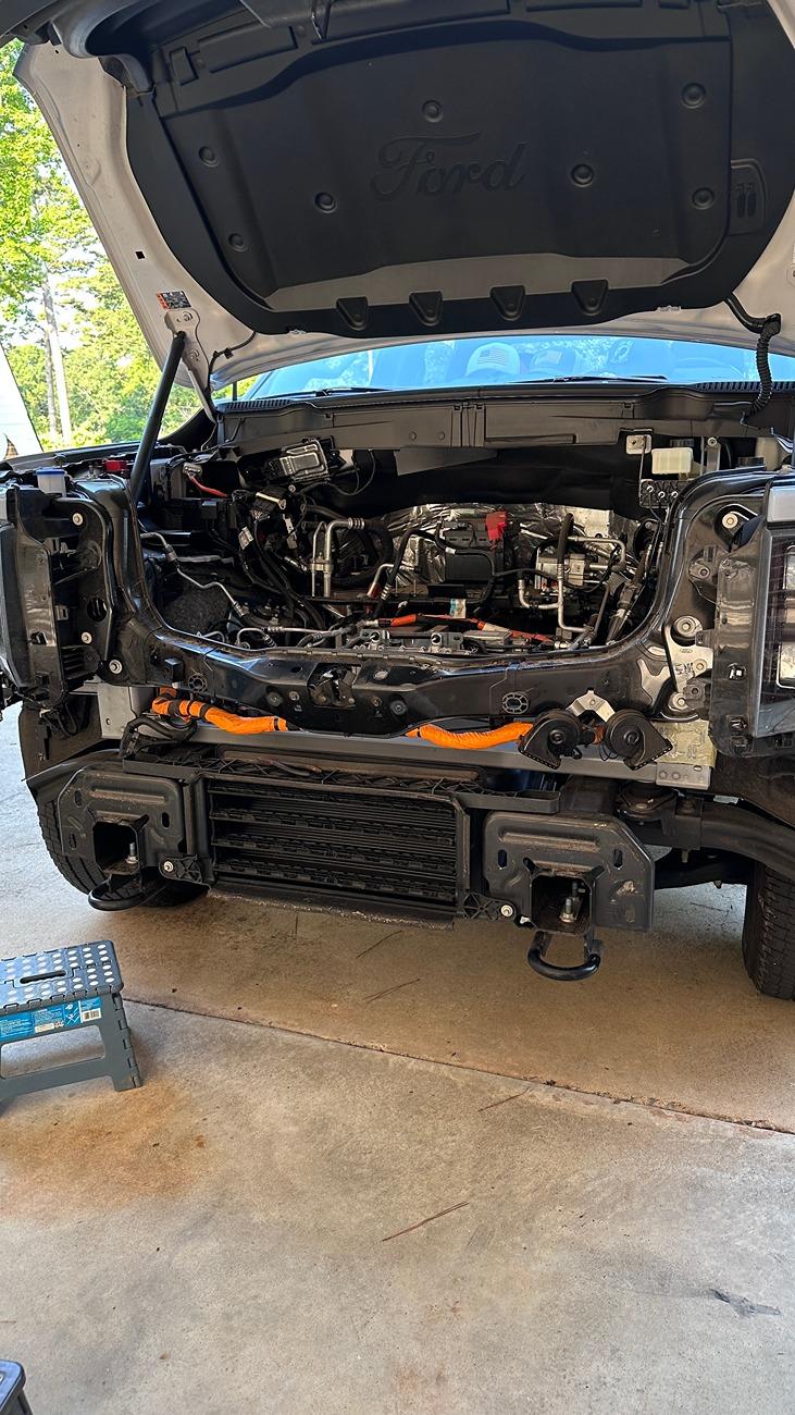 Ford F-150 Lightning What is this under the frunk? June 23 exposed removed front bumper, facia, valance, and frunk tub