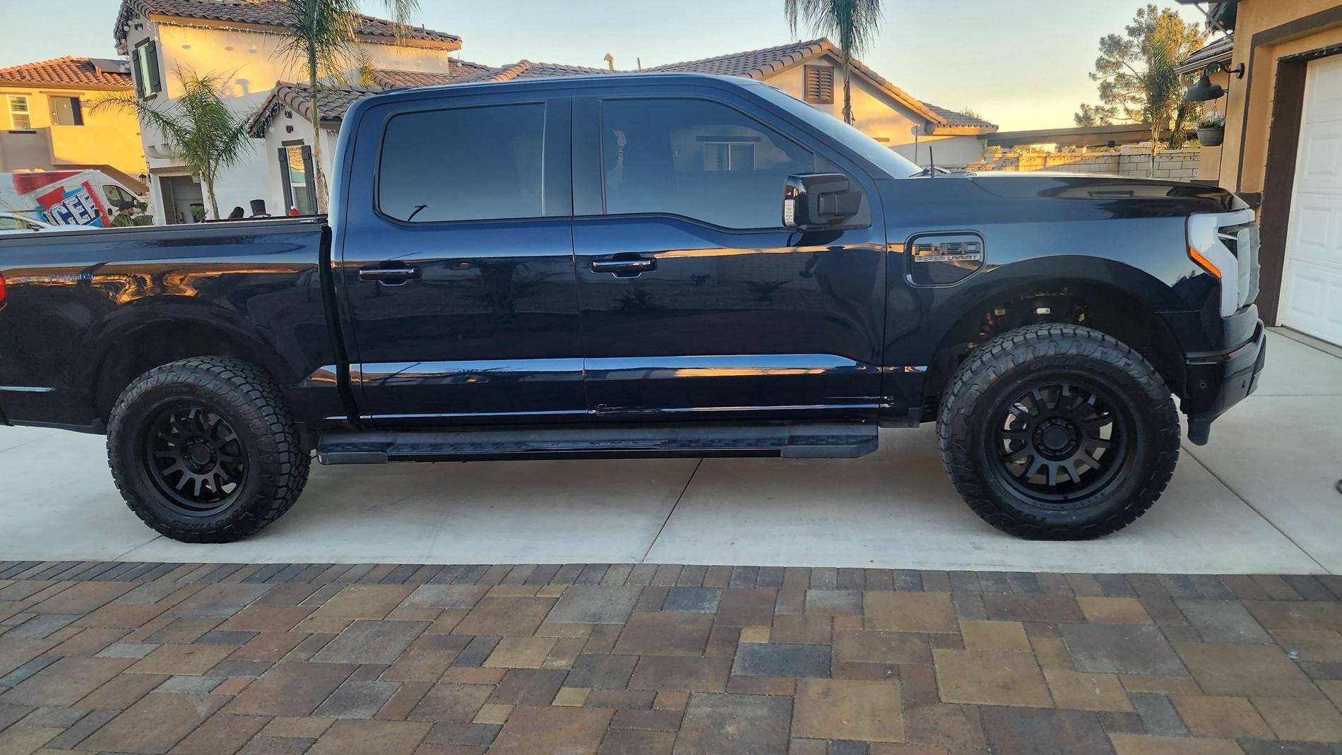 Ford F-150 Lightning Toyo Open Country AT3 EV Tires + Black Rhino Rapid 20x9 wheels +12mm, Rough Country 2" Level + Eibach Adjustable Shocks 20241207_161259