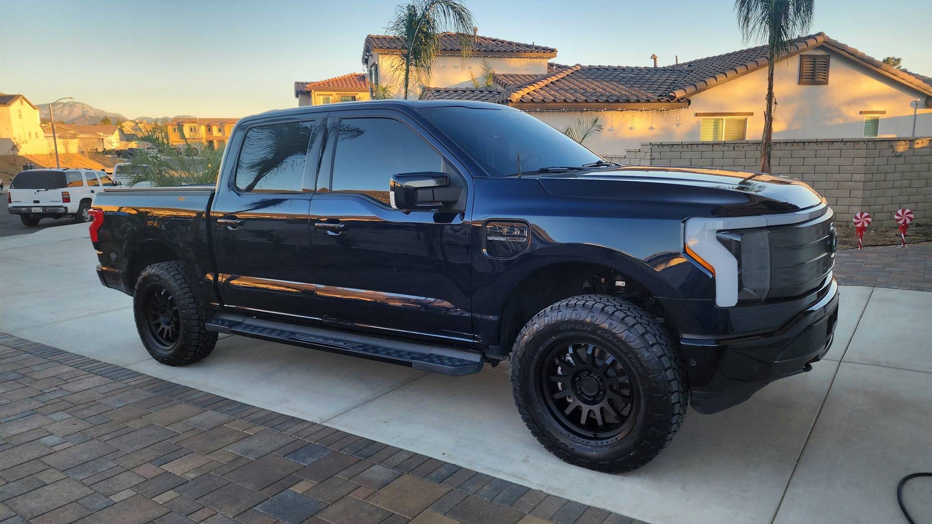 Ford F-150 Lightning Toyo Open Country AT3 EV Tires + Black Rhino Rapid 20x9 wheels +12mm, Rough Country 2" Level + Eibach Adjustable Shocks 20241207_161253
