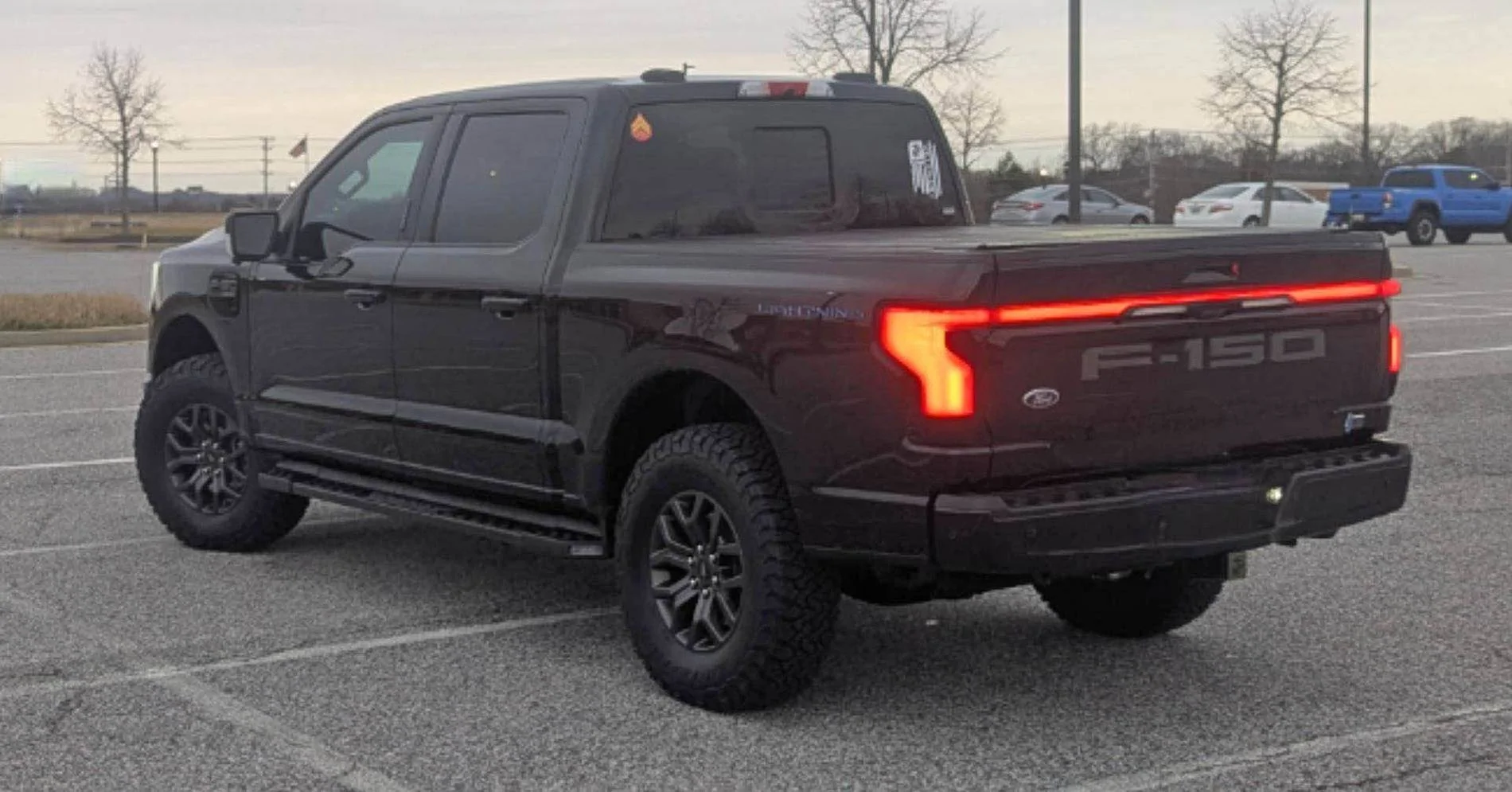 Ford F-150 Lightning Tremor wheels with KO3 tires + Eibach level kit installed After Back