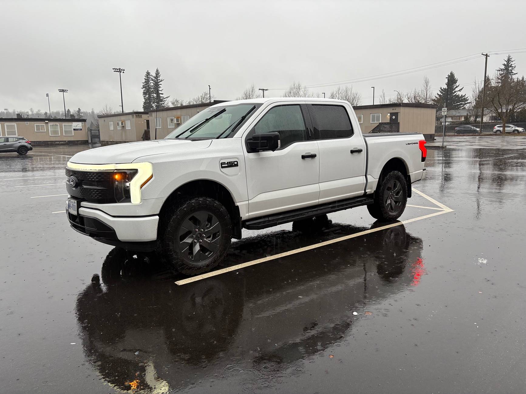Ford F-150 Lightning 2024 Oxford White XLT, 2” level, 34” Toyo AT3 IMG_5599