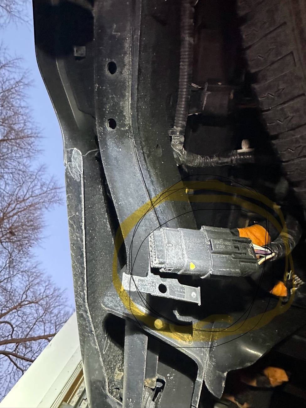 Ford F-150 Lightning Hanging wire under rear bumper IMG_6193