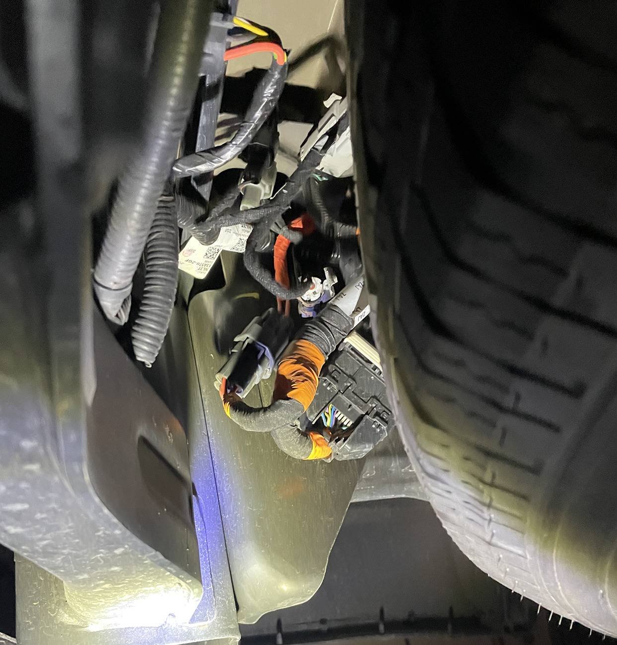 Ford F-150 Lightning Hanging wire under rear bumper 20250218_003955708_iOS