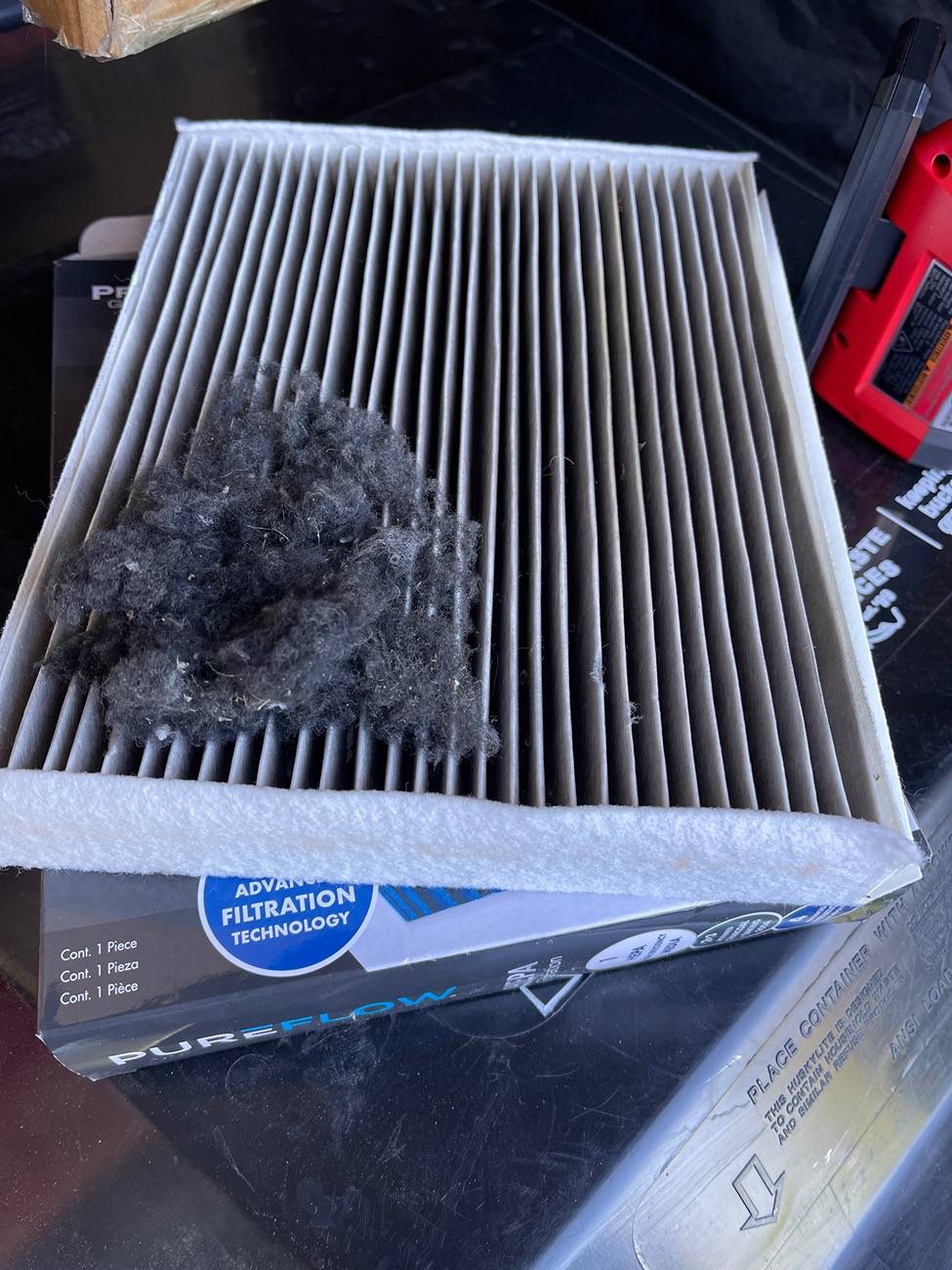 Ford F-150 Lightning Air filter change and debris image