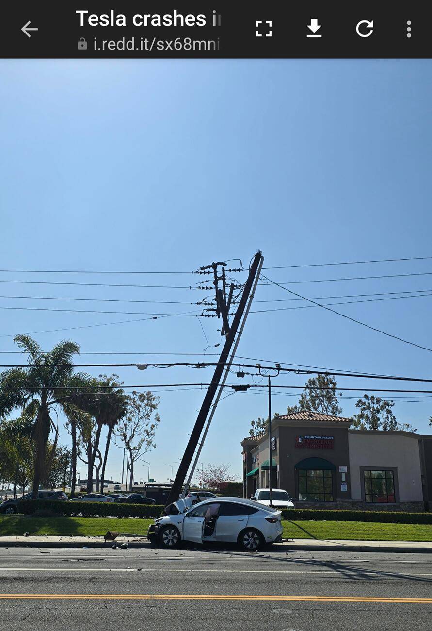 Ford F-150 Lightning A Mach-E pulls into a Tesla Supercharger. 1000030662