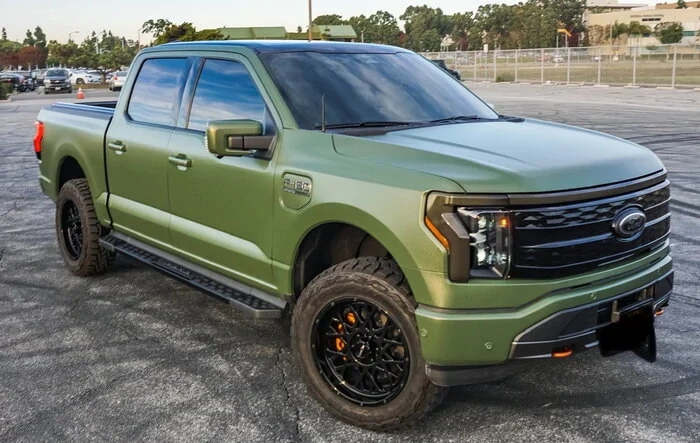 My wife isn’t happy, but worth it: 2022 F-150 Lightning Build w/ green wrap & many other mods