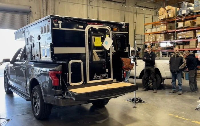 Slide in Pop-up Camper by Four Wheel Campers being assessed for Lightning