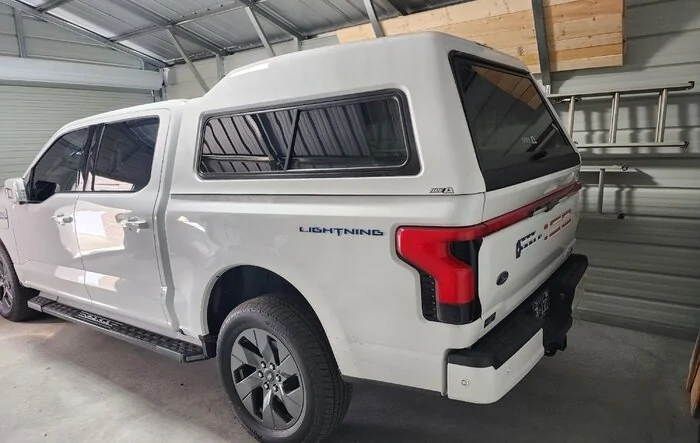 A.R.E. MX truck cap camper shell installed... no noticeable effect on range so far