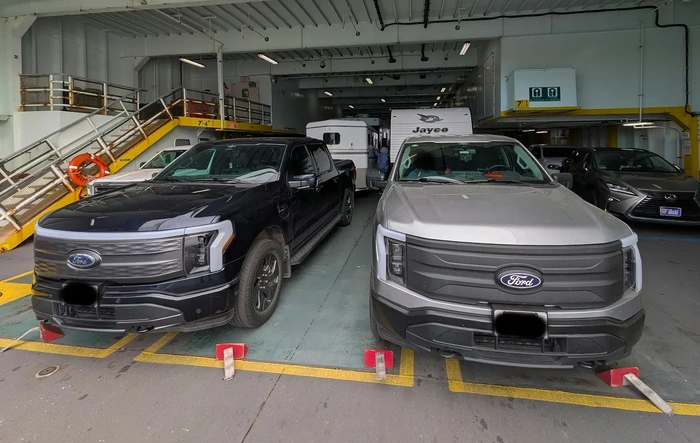 Two Lightnings meet on a ferry while towing...