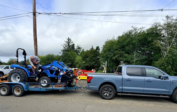 Towing compact tractor-loader w/ 5' mower on dbl axle